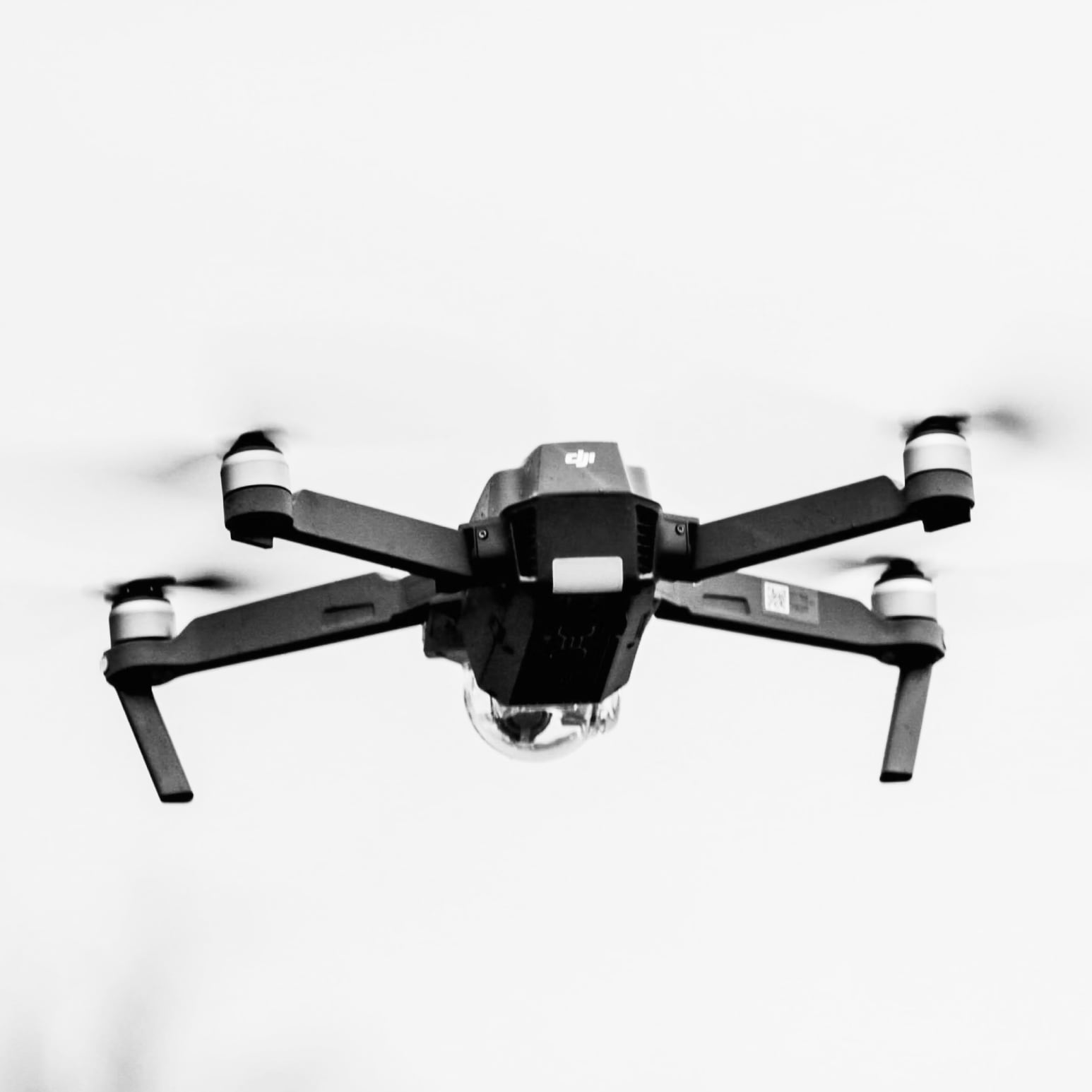Stock photo of DJI drone flying in black and white